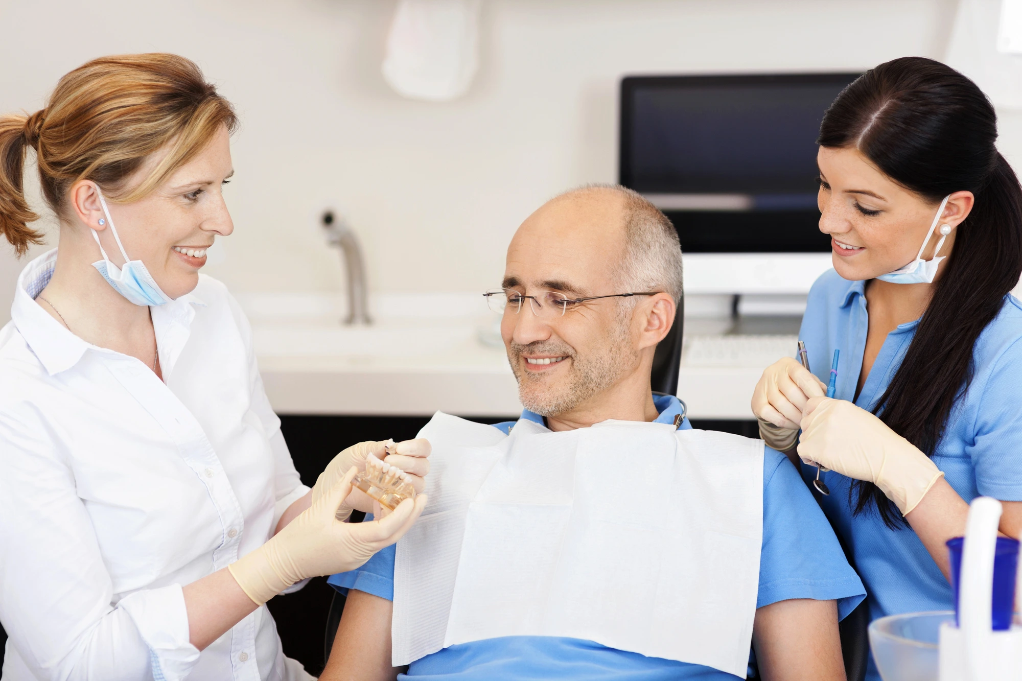 dental team reassuring patient about same day crowns in Leesburg, VA