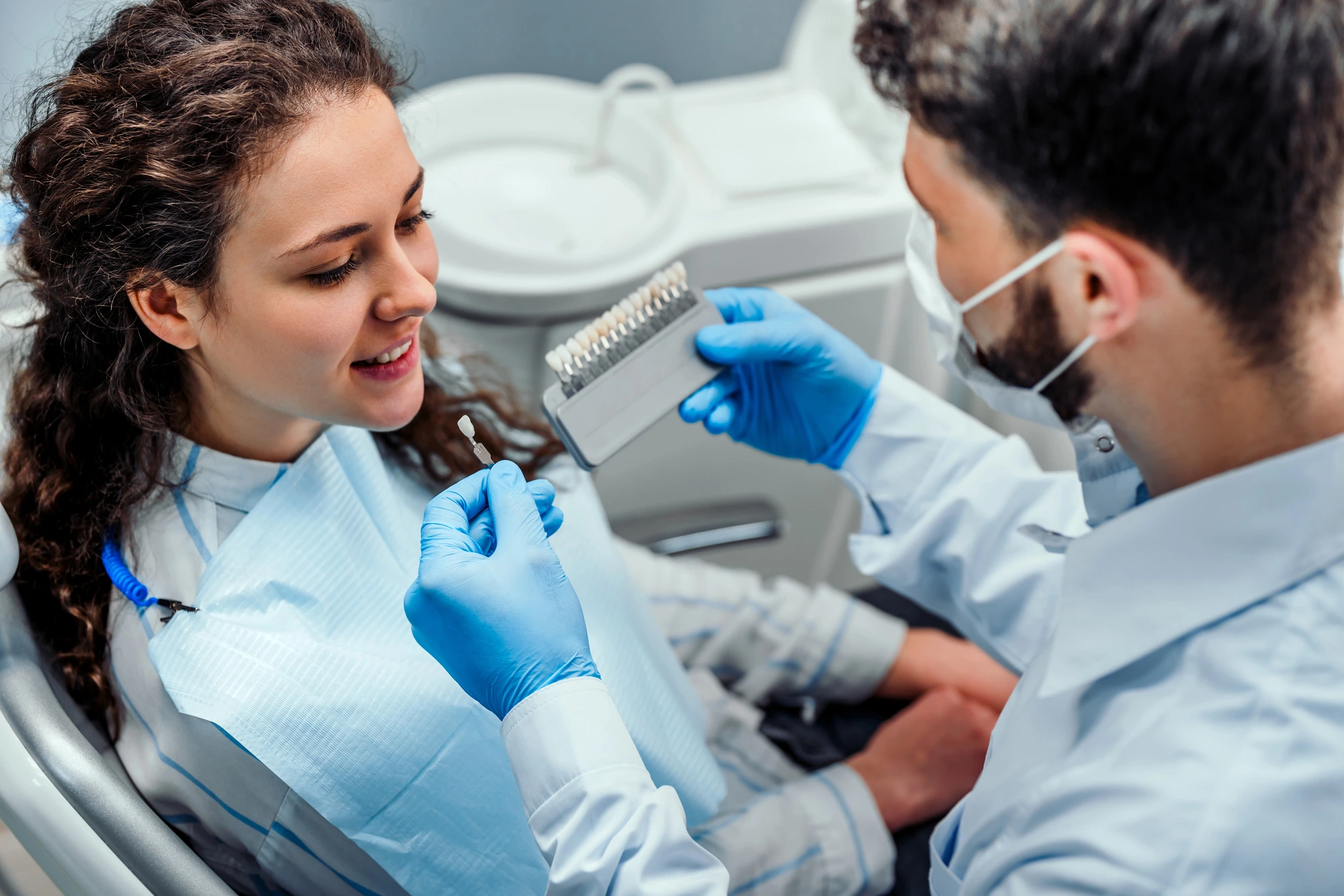 dentist showing patient different options for same day crowns in Leesburg, VA