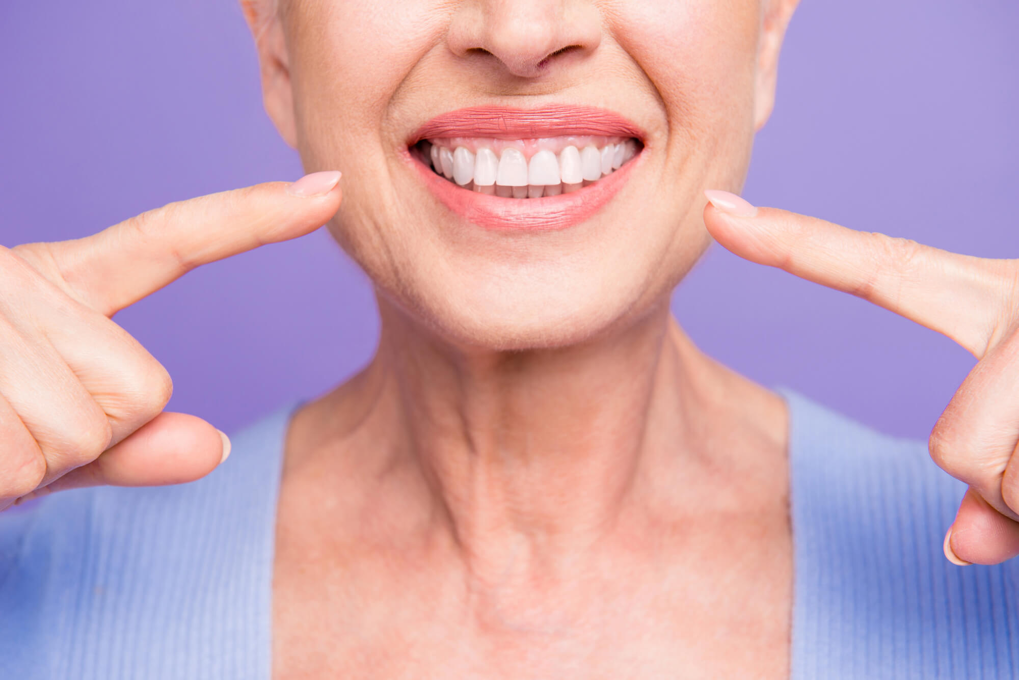 senior proudly wearing full mouth dental implants leesburg va