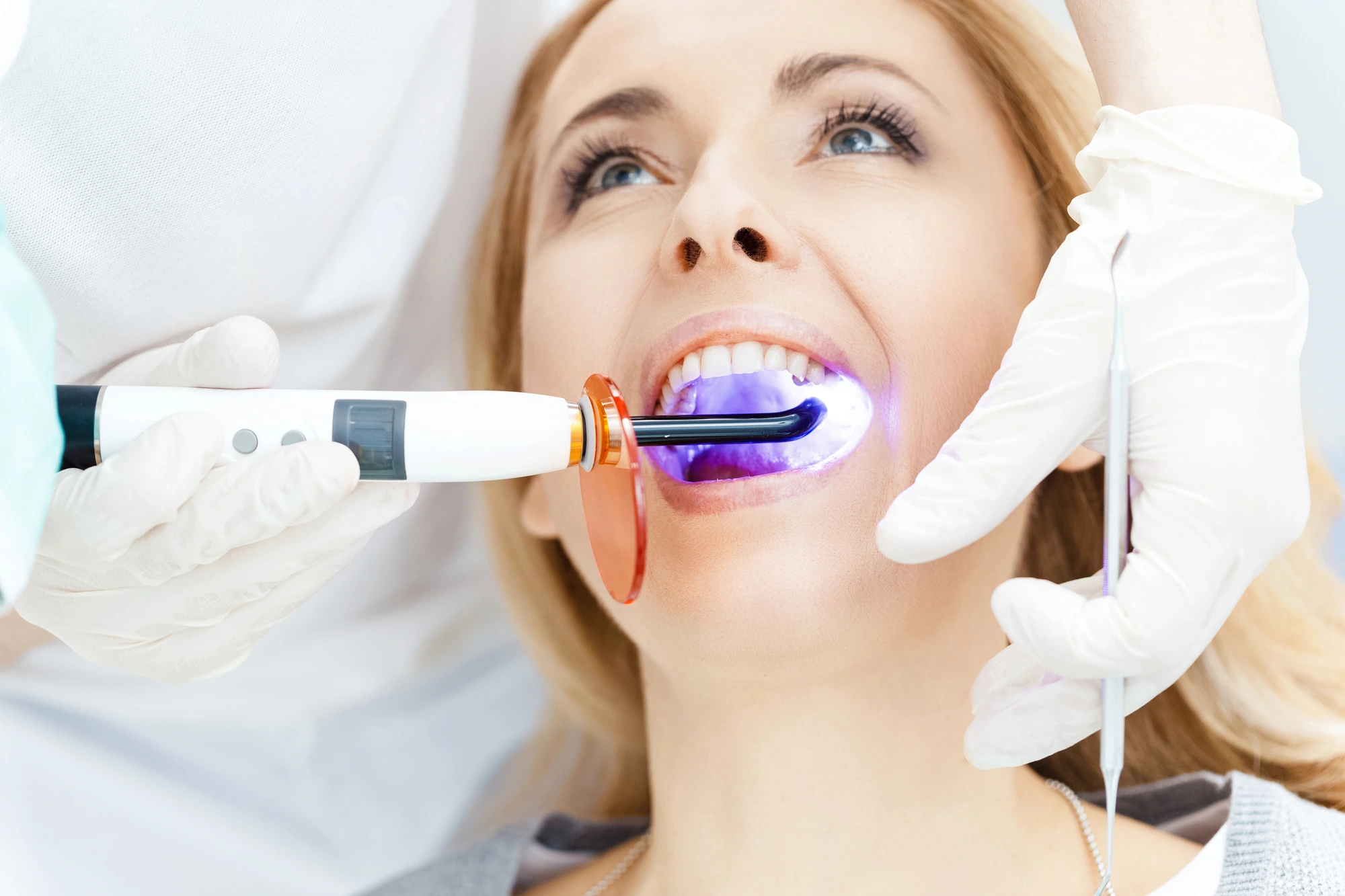 woman getting treatment from a Leesburg, VA, dentist
