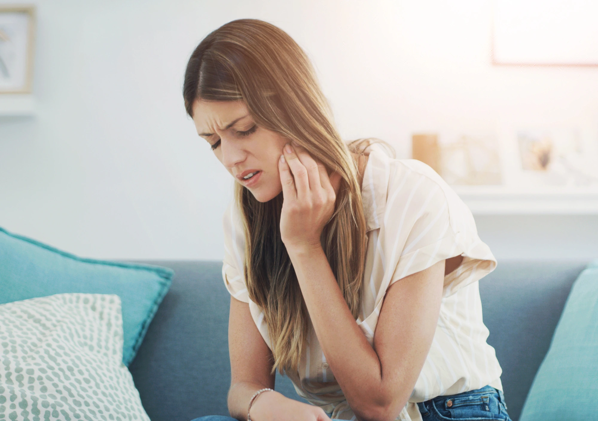 woman in pain before getting emergency crowns in Leesburg, VA